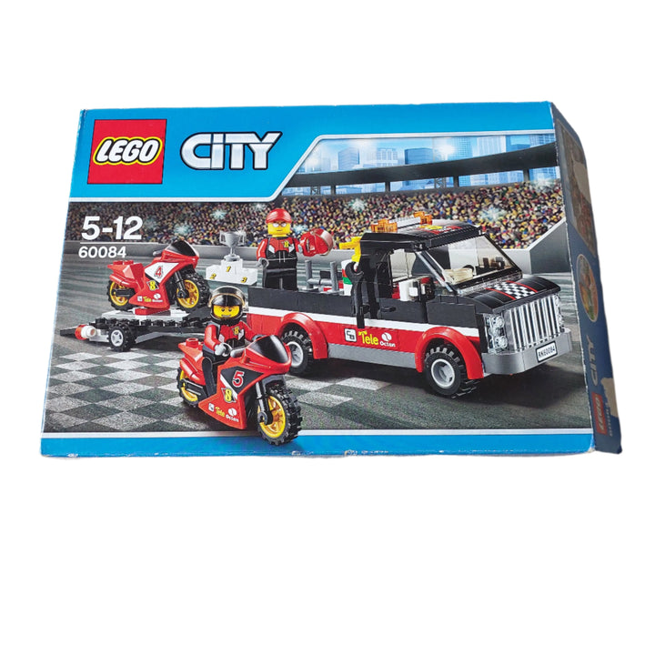 Lego, The LEGO City motorbike race team is heading to the stadium for the final race of the motorbike championships! Join the ace riders aboard the awesome Racing Bike Transporter together with their high-speed race bikes. When you arrive at the stadium, help unload the bikes and head for the circuit. The crowd is ecstatic, it's going to be a heck of a race! Who will take top spot on the podium and lift the championship trophy Includes 2 race driver minifigures with assorted accessories.