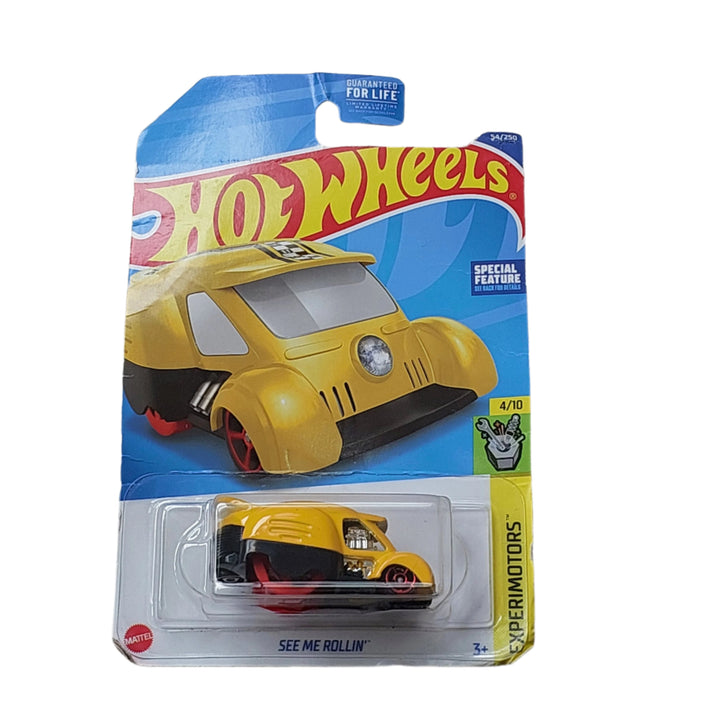 Hot Wheels, See Me Rollin', The See Me Rollin' is a dice-themed Hot Wheels car. The rear of the vehicle has a viewing port on the top with a singular, hexagonal wheel in the rear. Each face of the wheel is marked with dice pips, 1 through 6, with the viewing port showing a given face as the "rolled" number.