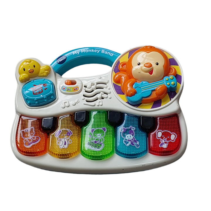 Vtech, Your little one is in the band! Your child will jam and learn with the Monkey Band Music Center™ by VTech® as they press light-up piano keys and tap the drum to hear an array of instruments. Animal friends on piano keys introduce themselves, sing songs and teach instrument names on this fun music toy. The adorable monkey encourages interaction with 2 sing-along songs and 10 playful melodies that keep the learning beat going. It’s time to sing and play!