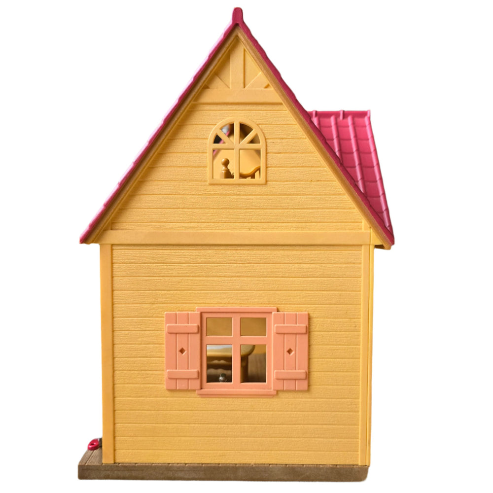 Sylvanian Families, The Cosy Cottage is the perfect choice those starting out with Sylvanian Families. With its red roof and beige brick style exterior, this quaint two floor cottage includes a ladder to connect the upstairs and downstairs.