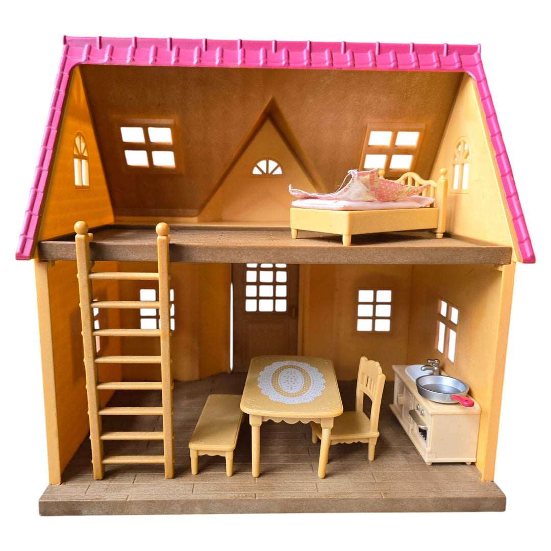 Sylvanian Families, The Cosy Cottage is the perfect choice those starting out with Sylvanian Families. With its red roof and beige brick style exterior, this quaint two floor cottage includes a ladder to connect the upstairs and downstairs.