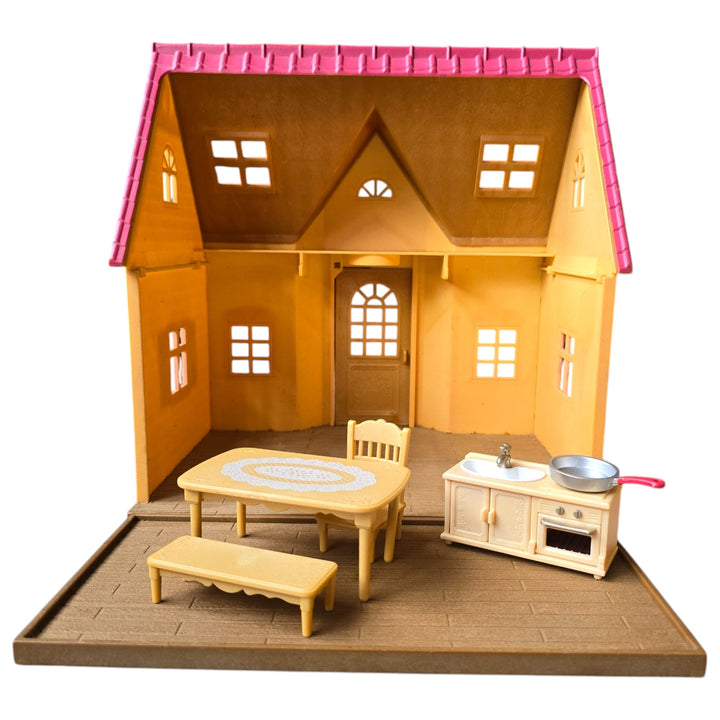 Sylvanian Families, The Cosy Cottage is the perfect choice those starting out with Sylvanian Families. With its red roof and beige brick style exterior, this quaint two floor cottage includes a ladder to connect the upstairs and downstairs.