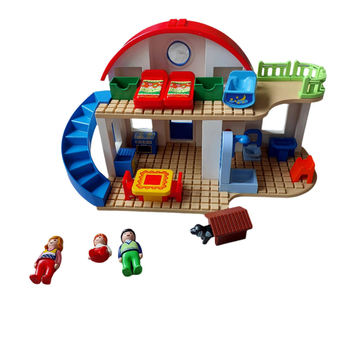 Playmobil, 6784 Suburban Home, Make yourself comfortable in this warm and cozy Suburban Home. With a bright and colorful design and large, rounded pieces, this PLAYMOBIL 1.2.3 set is ideal for toddlers. The two-story home comes with a fully-furnished kitchen, bathroom and bedroom and has a grid layout that makes securing furniture to the floors easy. Plus, kids will love the functioning doorbell and sound effects. Set includes three figures, bed, cradle, dog, doghouse, table and chairs, oven, sink, shower, 