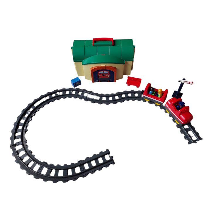 Playmobil, 6783 Take Along Train Set, All aboard! Cruise down the tracks on the My Take Along Train, With a bright and colorful design and large, rounded pieces, this Playmobil 1.2.3 set is ideal for toddlers, Train station doubles as a carrying case, making it the perfect set for toddlers on the go, Simply unlatch the side to reveal storage space for the three figures, two train cars, tracks, bench, suitcase, and traffic sign, Encourages children to explore and learn while having fun.