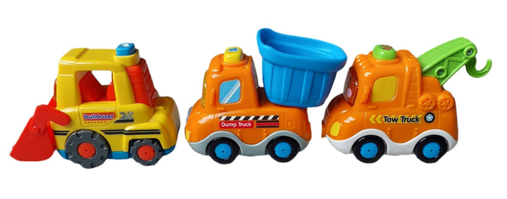 Vtech, Smart Wheels Construction Vehicle Pack, With this VTech Toot Toot Construction Vehicles Toyset, toddlers will love hearing new words as they make friends with Ben the Bulldozer, Doug the Dump Truck and Tony the Tow Truck. Press the light-up windshield on each vehicle to hear phrases, songs, melodies, and the letters “B”, “D” and “T”. Each vehicle has a mechanical part that moves for fine-motor development.
