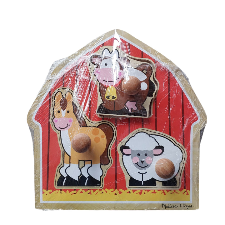 Melissa & Doug, Barnyard Animals Jumbo Knob Puzzle, Charming farm friends live in the red barn and are always ready for puzzle play. This extra thick wooden puzzle includes three pieces, with jumbo wooden knobs for easy grasping. Full-color, matching pictures appear underneath each piece. A great activity to encourage hand-eye and visual perception skills.