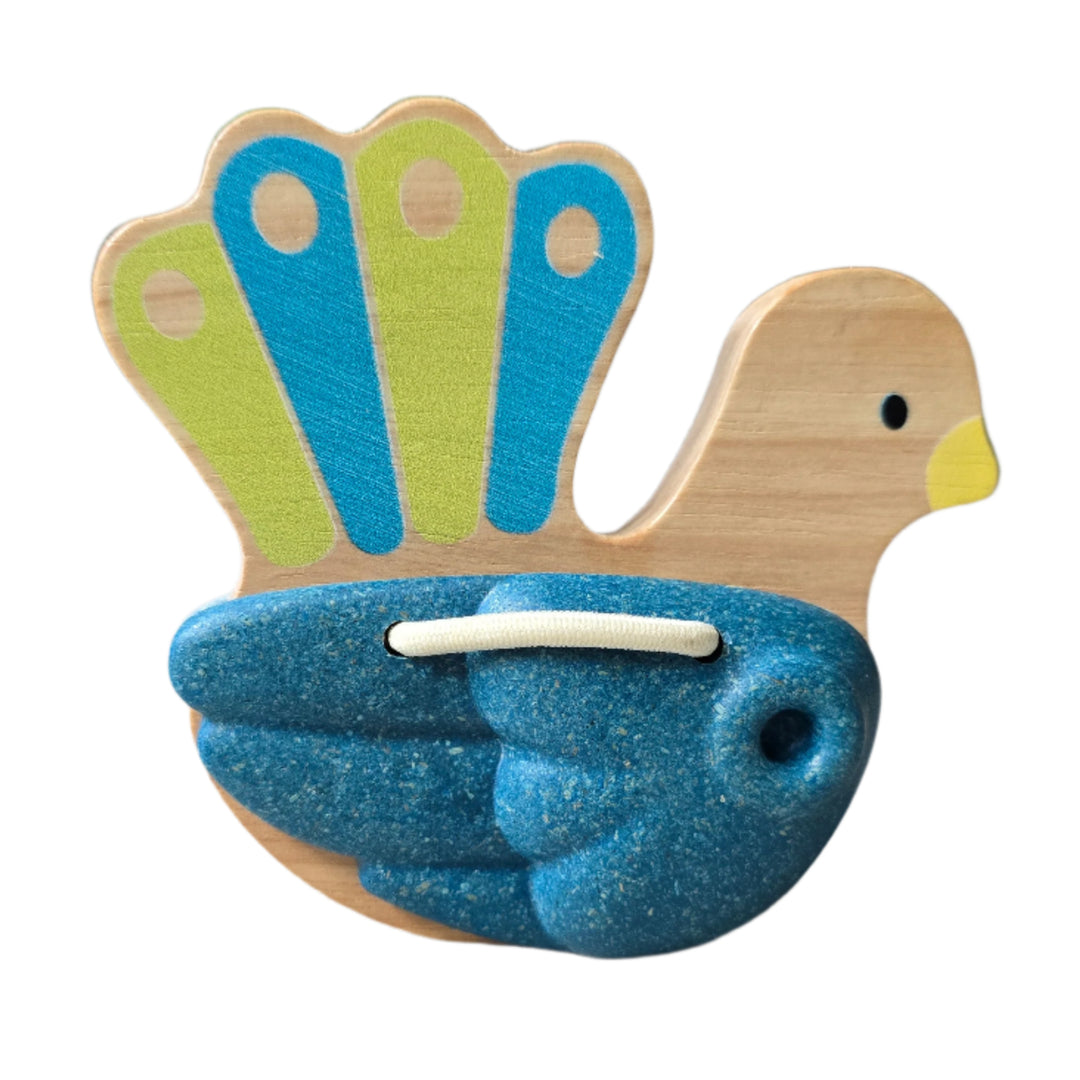 PlanToys, Toddlers will love to make some noise with this pretty peacock clapper toy. Hold onto the wooden handle and shake the clapper to make a clacking sound. This percussion instrument is made from solid rubberwood and Planwood, an eco product made from recycled rubberwood sawdust.