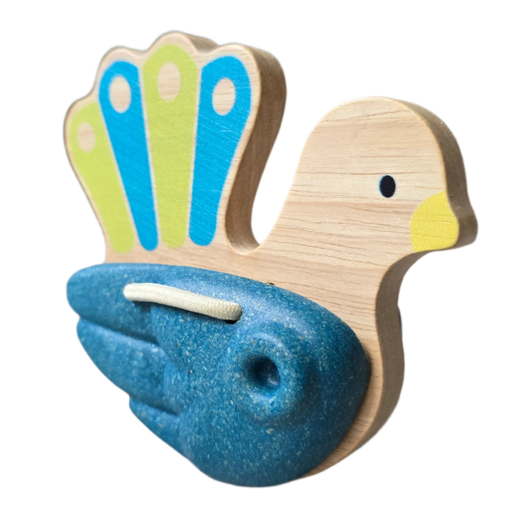 PlanToys, Toddlers will love to make some noise with this pretty peacock clapper toy. Hold onto the wooden handle and shake the clapper to make a clacking sound. This percussion instrument is made from solid rubberwood and Planwood, an eco product made from recycled rubberwood sawdust.