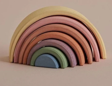 Raduga Grez, Pastel Earth Arch Stacker, The pastel earth rainbow stacking toy is hand-made by Raduga Grez; a family-run company that makes solid wood toys with the aim of 'celebrating creativity'. Their toys are loved by children and adults alike.