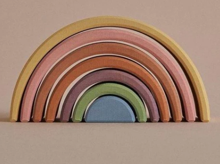 Raduga Grez, Pastel Earth Arch Stacker, The pastel earth rainbow stacking toy is hand-made by Raduga Grez; a family-run company that makes solid wood toys with the aim of 'celebrating creativity'. Their toys are loved by children and adults alike.