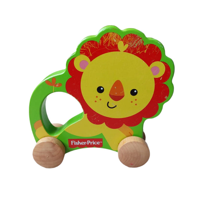 Fisher Price, My First Lion On Wheels, A wooden rolling lion pulled with string, this little lion on wheels is made of solid wood. For ages 12 months and above.