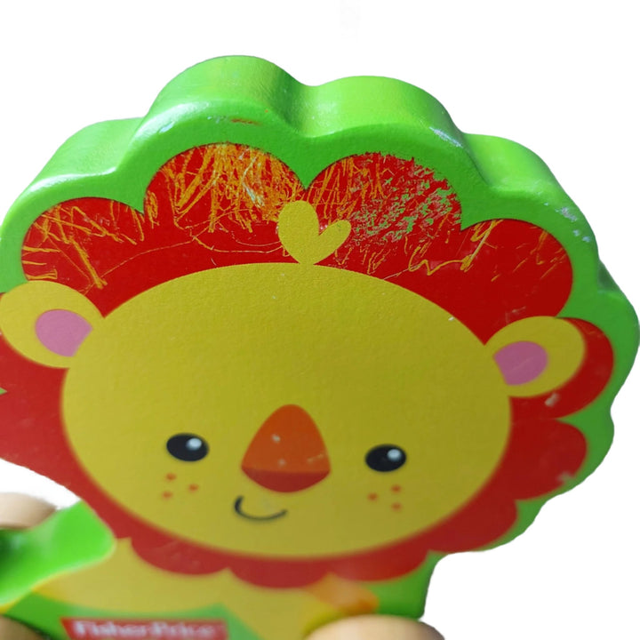 Fisher Price, My First Lion On Wheels, A wooden rolling lion pulled with string, this little lion on wheels is made of solid wood. For ages 12 months and above.