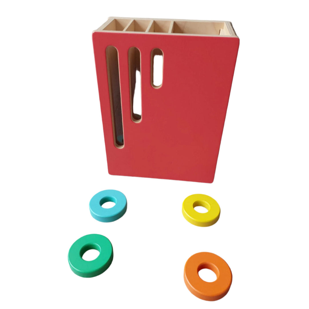 Lovevery, Count And Sldie Ring Chute (Realist Play Kit), Let your toddler explore the consequences of adding more weight into the box. See how many rings you can slide through the slots before one comes shooting out!