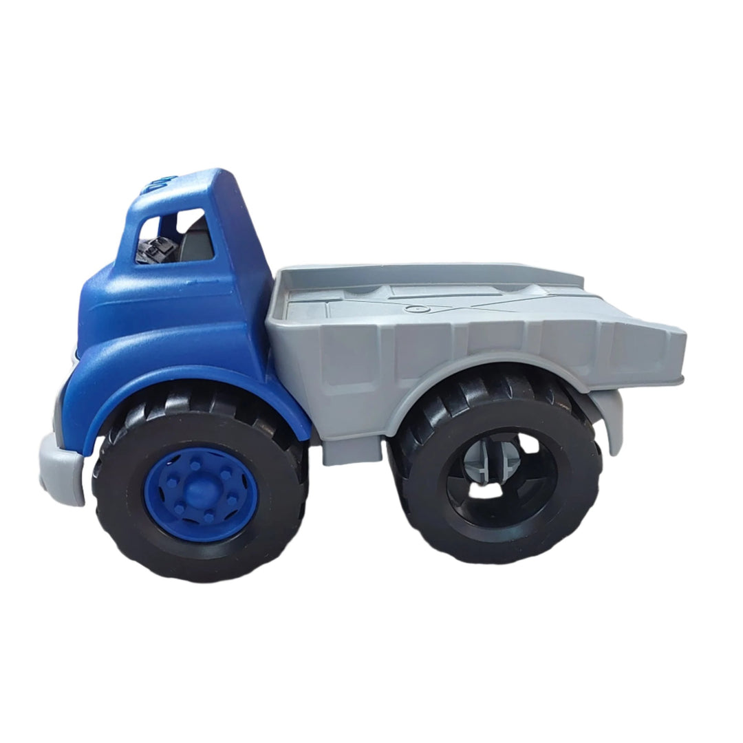 Green Toys, Flatbed Truck, The Green Toys Flatbed Truck with Race Car is on the move. This sturdy blue truck hauls our sleek red hot rod on its back, and has a flatbed that tilts up to allow the car to roll off. These eco-conscious vehicles are made in the USA from 100% recycled plastic milk containers that save energy and reduce greenhouse gas emissions. 