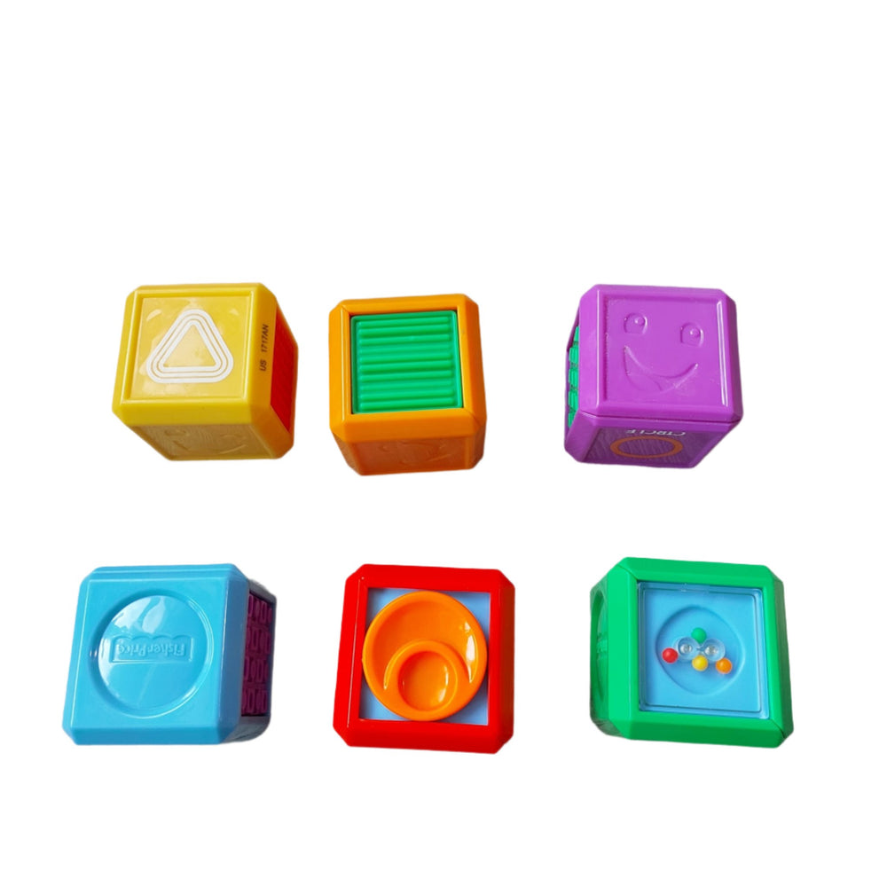 Fisher Price, Laugh & Learn First Words Shape Blocks, Build your little one's vocabulary with this pack of six colorful blocks that help teach your baby familiar and advanced shapes and first words! With six sides of sensory play and a variety of hands-on activities, these blocks keep little hands (and minds) working all day. Bring the blocks over to the Laugh & Learn First Words Smart Puppy (sold separately) to hear phrases and sounds that advance with each Smart Stages level, helping to build the connecti