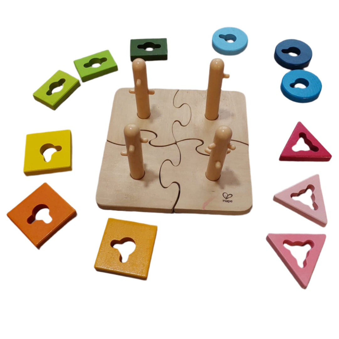 Hape, Creative Peg Puzzles, Cognitive & Motor Skills Development, Practice basic shape and color recognition with this best-selling, innovatively designed toy from Hape! The Creative Peg Puzzle has grooved shapes and pegged posts, adding an extra dimension of challenge to this colorful puzzle, and providing children hours of entertainment. Join the four puzzle bases together and then twist the variously shaped and colored puzzle pieces onto the posts. 