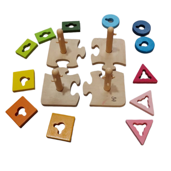 Hape, Creative Peg Puzzles, Cognitive & Motor Skills Development, Practice basic shape and color recognition with this best-selling, innovatively designed toy from Hape! The Creative Peg Puzzle has grooved shapes and pegged posts, adding an extra dimension of challenge to this colorful puzzle, and providing children hours of entertainment. Join the four puzzle bases together and then twist the variously shaped and colored puzzle pieces onto the posts. 