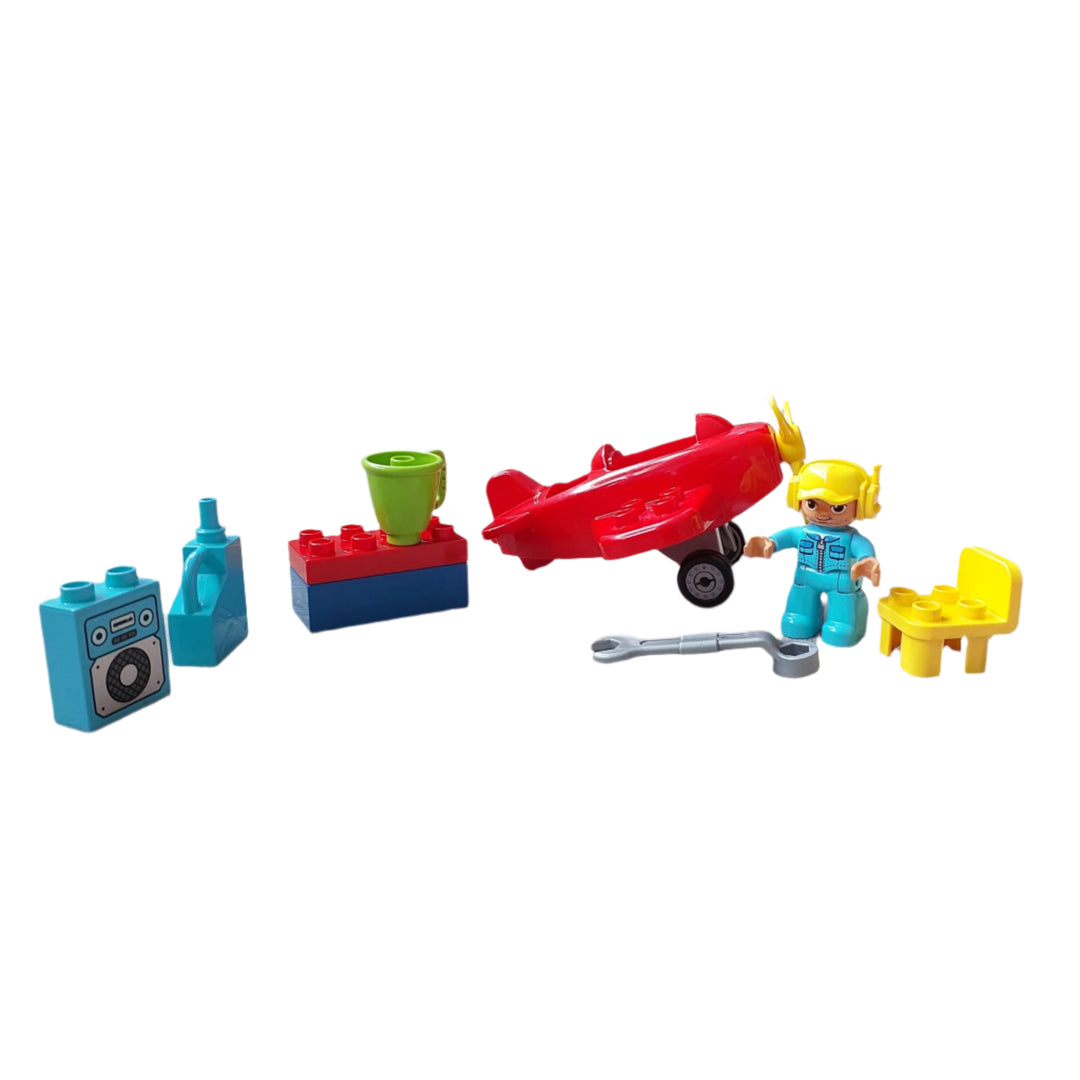 Lego, Town Plane (10908), Build a little workshop and use the tools to fix up the cute red propeller plane toddler toy! This toy airplane for kids includes a LEGO DUPLO pilot figure, workshop table and chair, oilcan, wrench, mug and a radio.