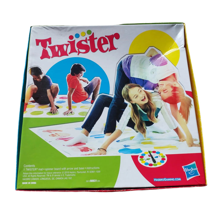 Hasbro, Twister, Add a twist of fun to any party or family night in with the classic game that ties players up in knots! One person gives the spinner a whirl – see what’s next as players try to keep their hands and feet on the mat! Right foot red! Who can do it? Left foot green – who’s got it? If a player’s knee or elbow touches the mat or falls over, they’re out. The last player standing wins!