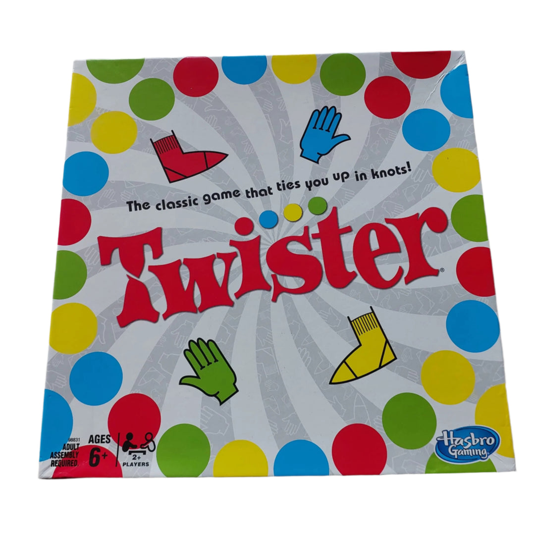 Hasbro, Twister, Add a twist of fun to any party or family night in with the classic game that ties players up in knots! One person gives the spinner a whirl – see what’s next as players try to keep their hands and feet on the mat! Right foot red! Who can do it? Left foot green – who’s got it? If a player’s knee or elbow touches the mat or falls over, they’re out. The last player standing wins!