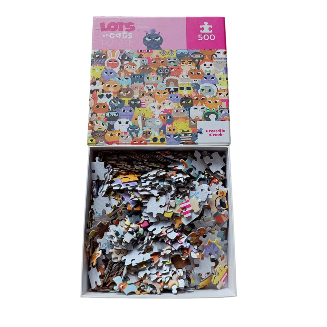 Crocodile Creek, Lots of cats puzzle, Crocodile Creek lots of cats is a 500 piece jigsaw puzzle is great for family or individuals - and of course cat lovers! This puzzle is a collection of artful and whimsical cats! Cats in glasses, tiaras, even bunny ears and so much more!