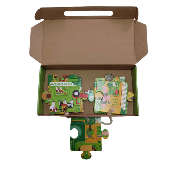 Petitcollage, At the farm puzzle, Follow the trail to get to the big red barn! Can you spot all 20 items on this friendly farm? The fun starts after this chunky 10 piece puzzle is assembled. Little ones must follow the indented maze with their finger and then spot 20 different items along the way.