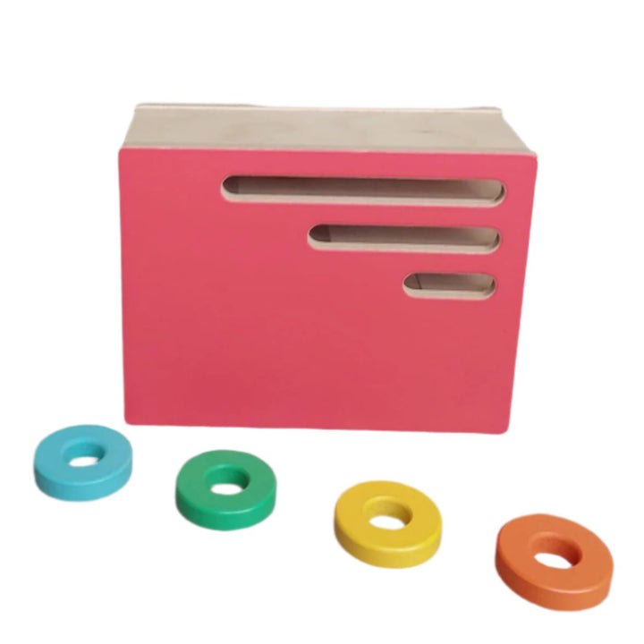 Lovevery, Count And Sldie Ring Chute (Realist Play Kit), Let your toddler explore the consequences of adding more weight into the box. See how many rings you can slide through the slots before one comes shooting out!