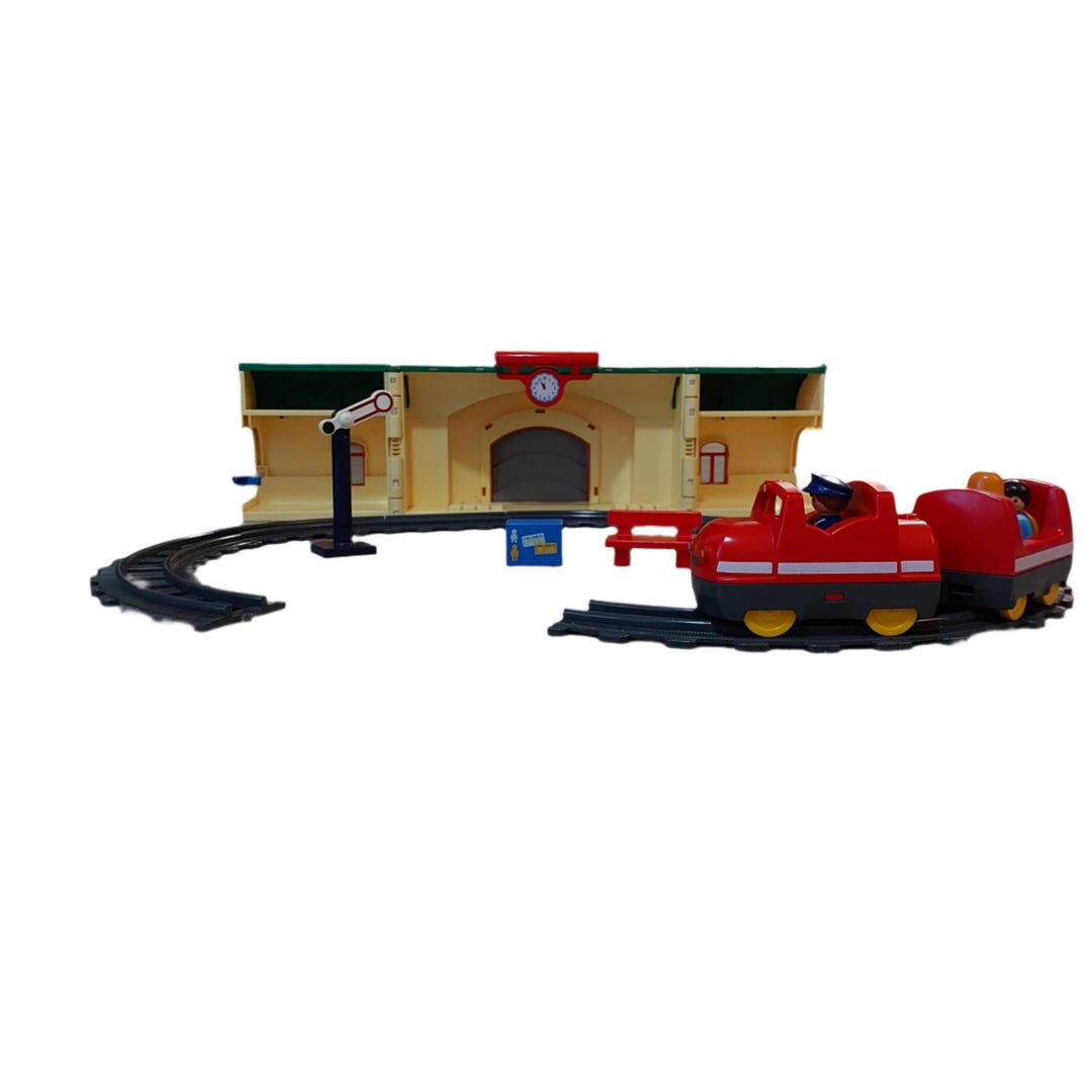 Playmobil, 6783 Take Along Train Set, All aboard! Cruise down the tracks on the My Take Along Train, With a bright and colorful design and large, rounded pieces, this Playmobil 1.2.3 set is ideal for toddlers, Train station doubles as a carrying case, making it the perfect set for toddlers on the go, Simply unlatch the side to reveal storage space for the three figures, two train cars, tracks, bench, suitcase, and traffic sign, Encourages children to explore and learn while having fun.