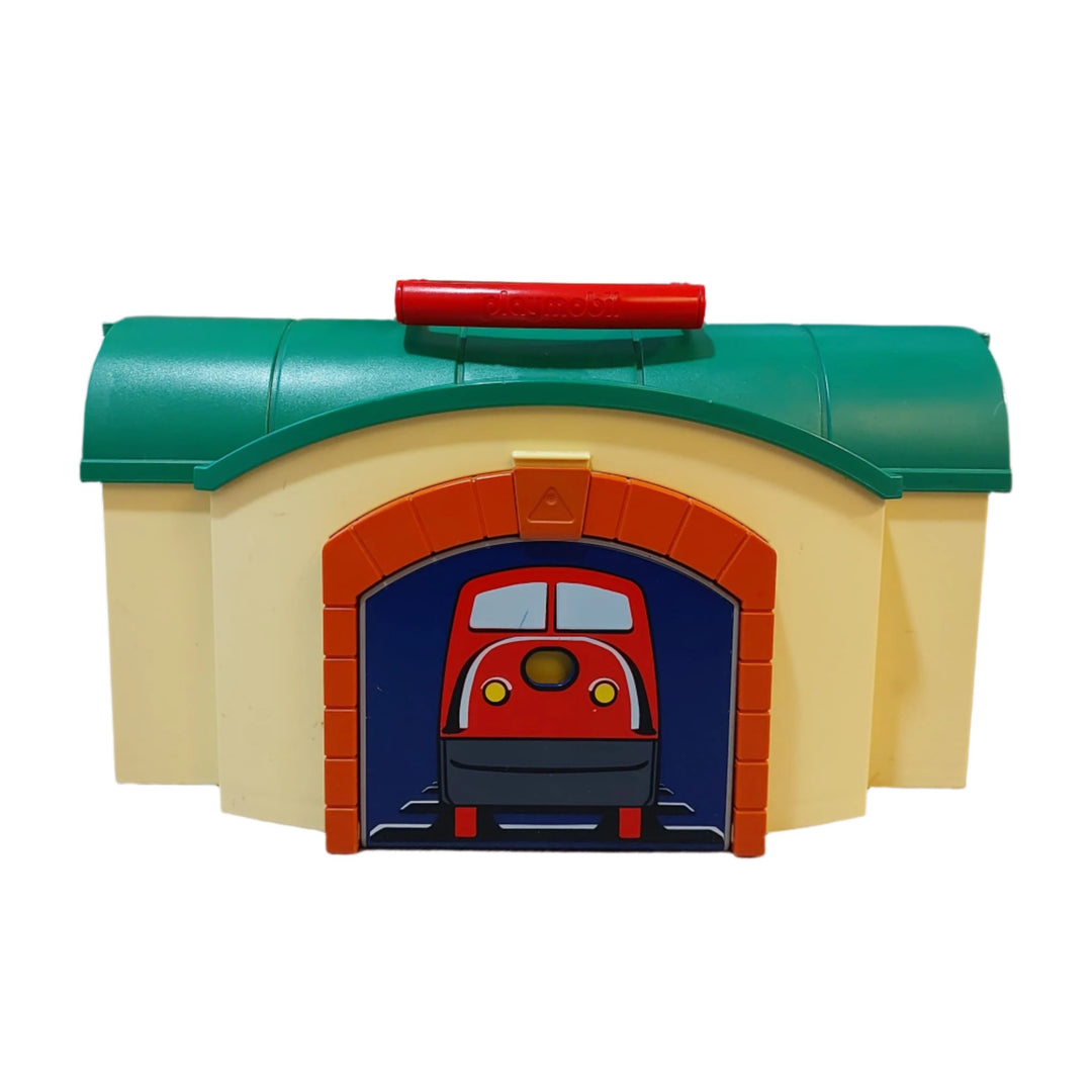 Playmobil, 6783 Take Along Train Set, All aboard! Cruise down the tracks on the My Take Along Train, With a bright and colorful design and large, rounded pieces, this Playmobil 1.2.3 set is ideal for toddlers, Train station doubles as a carrying case, making it the perfect set for toddlers on the go, Simply unlatch the side to reveal storage space for the three figures, two train cars, tracks, bench, suitcase, and traffic sign, Encourages children to explore and learn while having fun.