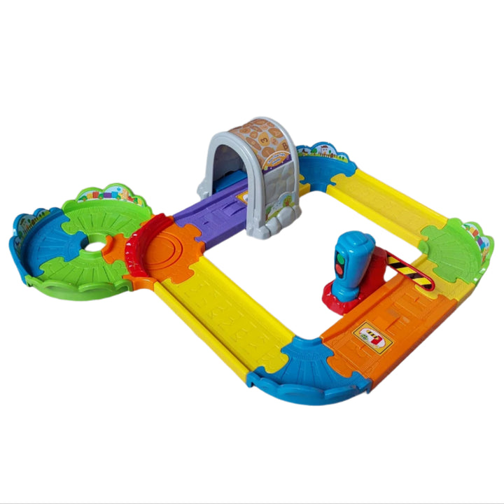 Vtech, Smart Wheels Choo Choo Train Playset, The Go! Go! Smart Wheels Choo-Choo Train Play set from VTech features a motorized train engine that responds with sounds and phrases when crossing over Smart Point locations along the tracks. Your child can arrange the track pieces in a variety of different ways and then watch as the motorized train engine chugs into the tunnel or through the gate.