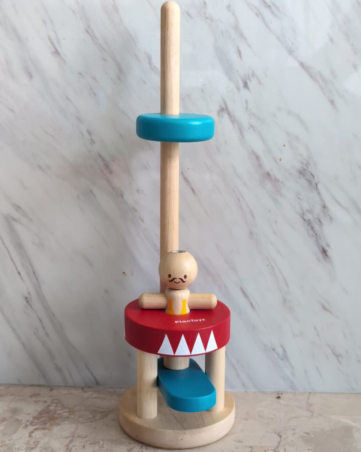 PlanToys, Jumping Acrobat, Cognitive & Motor Skills Development, Let’s have some fun with the Jumping Acrobat! Push the Blue bar down to make the acrobat jump up to the top. This helps enhance observational and experimental skills.