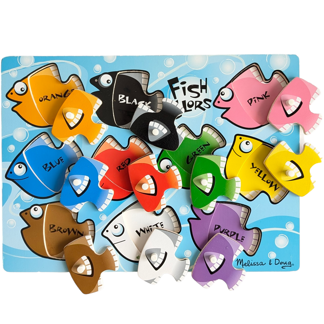 Melissa & Doug, Fish Colours Mix N Match Fresh Start Peg Puzzles, Cognitive & Motor Skills Development , With the ten interchangeable pieces included in this wooden peg puzzle with ten vibrant fish, kids can create a new school of fish every time! The pieces have the colour names underneath them. improves fine motor, hand-eye coordination, and artistic expression.