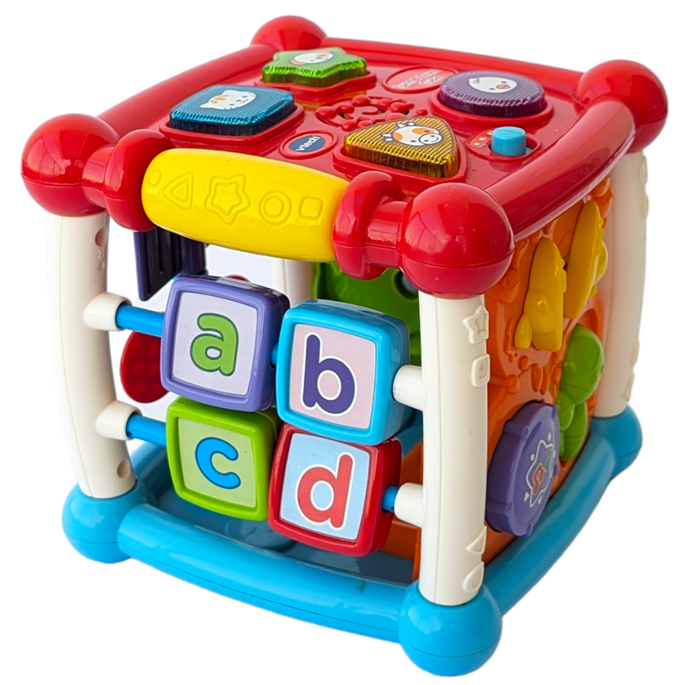 VTech, Turn and Learn Cube, Sensory & Language Development, Exploration and fun is around every corner with the Busy Learner’s Activity Cube™ by VTech®. Featuring five sides to explore, this play cube attracts your baby’s attention and encourages imaginative play with music, light-up buttons, colors and more. Shape and animal buttons introduce animal names, animal sounds and shapes. Press and slide musical instrument buttons introduce instrument names, sounds and colors.