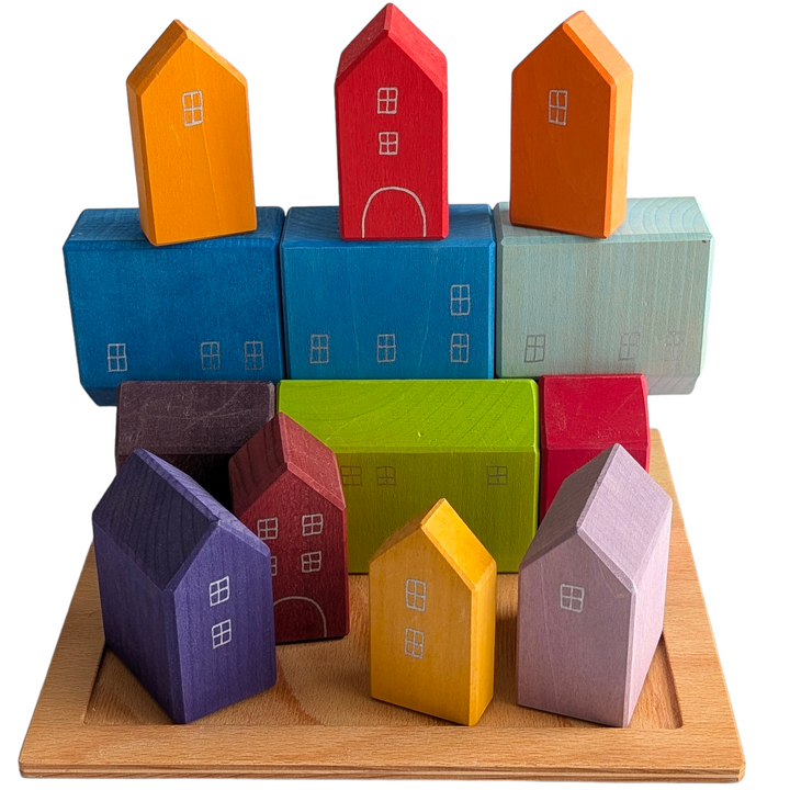 Grimms, Small Houses, Creative & Imaginative Play, Blocks in the shape of a house, with windows and doors painted by hand Flexible plaything Made by hand in Germany Included with a wooden tray for displaying and storing Solid wood construction with water-based, non-toxic staining