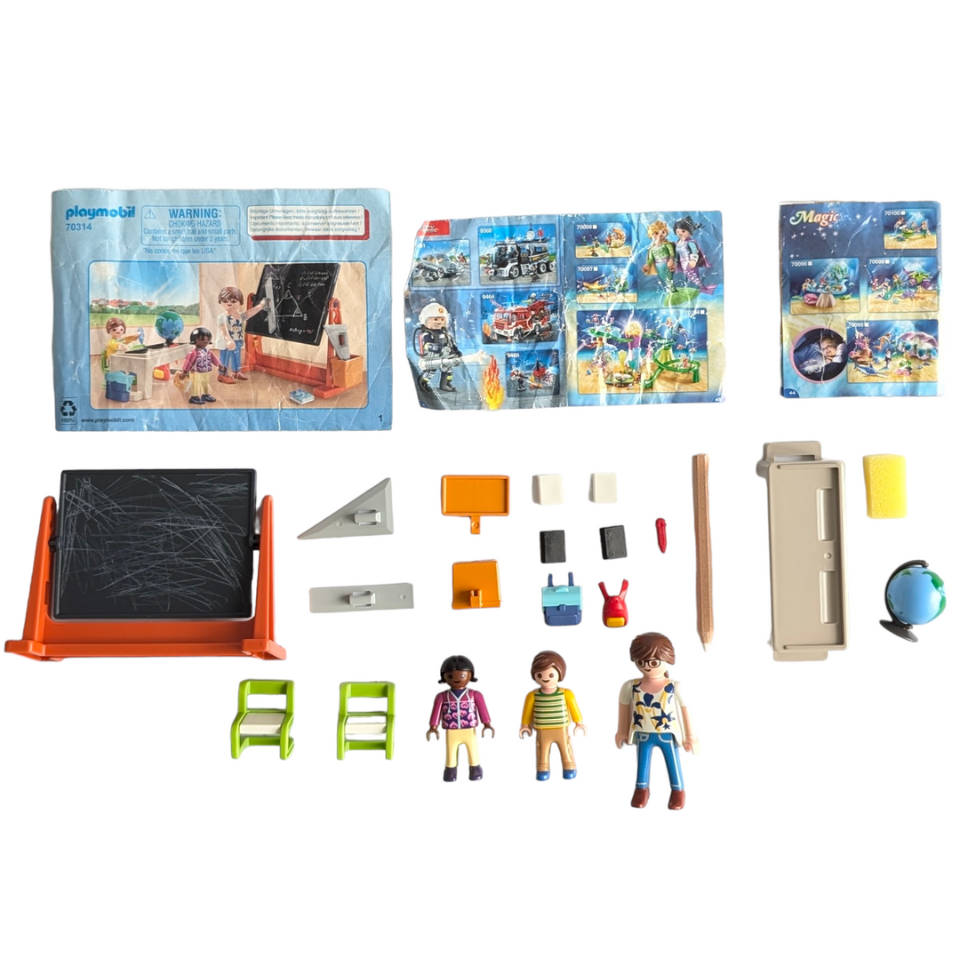 Playmobil, City life school carry case, Social & Emotional Development, Take-along learning fun with the School Carry Case. The travel-friendly playset features a swivelling blackboard, which can be written on using the included pencil. The writing can then be erased using the included sponge. The playset is complete with three figures, furniture and accessories.