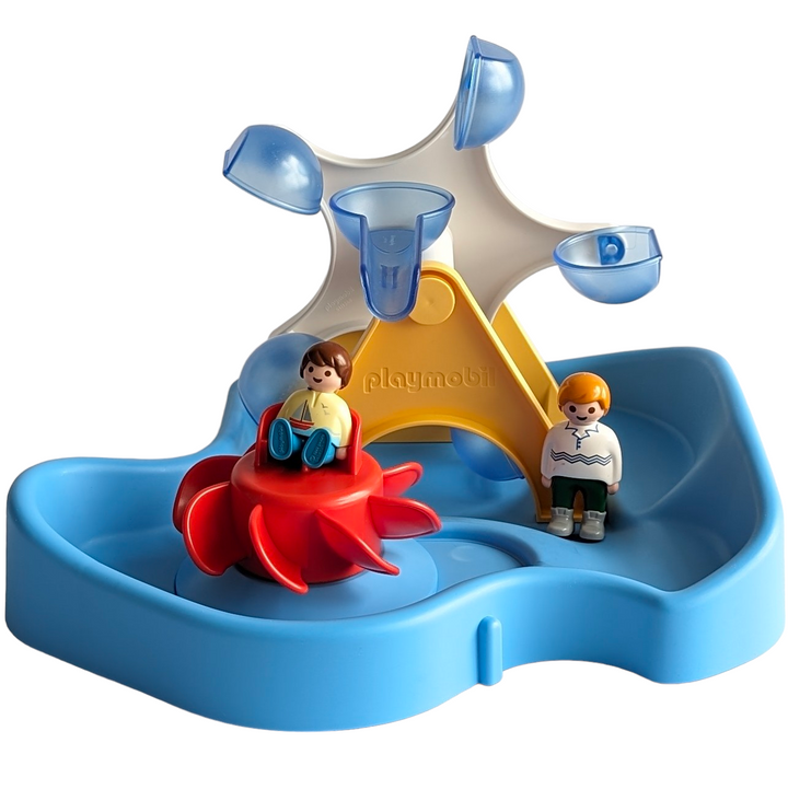 Playmobil, Aqua Water Wheel Carousel, Cognitive & Motor Skills Development, Yoo-hoo, the merry-go-round's moving! Turn the crank of the water wheel and the carousel ride begins. Can be combined with 70269 water rocker with watering can & 70270 water slide. Dimensions: 30 x 28 x 18 cm (LxDxH).
The Water Wheel with Carousel of PLAYMOBIL 1.2.3 AQUA is just the right thing for little water fans. First fill the pool with water, then the little figure can take a seat in the carousel and it's time for the crank. 