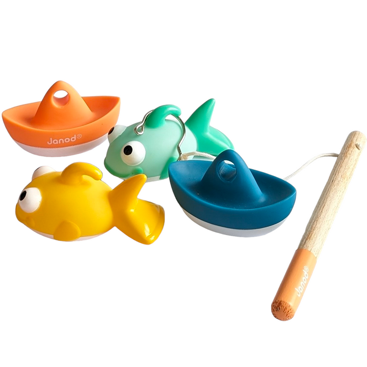 Janod, Bath Time Fish Them All, Cognitive & Motor Skills Development, This line fishing game for the bath with 4 squirters is ideal for developing your child's dexterity and concentration. To play, just catch the boats and small fish as quickly as possible with the fishing rod! By pressing the boat or the belly of the fish, they spits water. For hours of play!