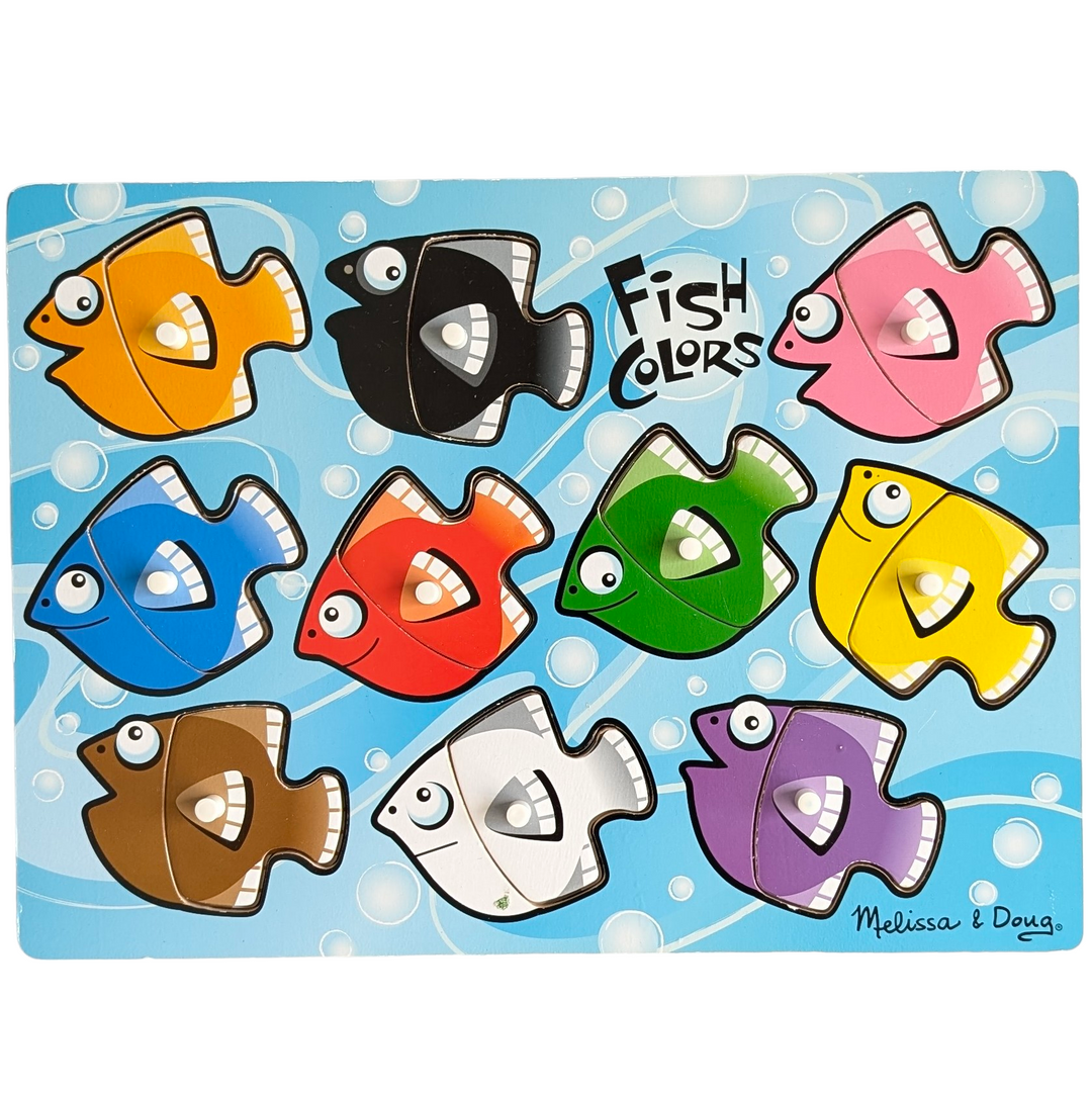 Melissa & Doug, Fish Colours Mix N Match Fresh Start Peg Puzzles, Cognitive & Motor Skills Development , With the ten interchangeable pieces included in this wooden peg puzzle with ten vibrant fish, kids can create a new school of fish every time! The pieces have the colour names underneath them. improves fine motor, hand-eye coordination, and artistic expression.