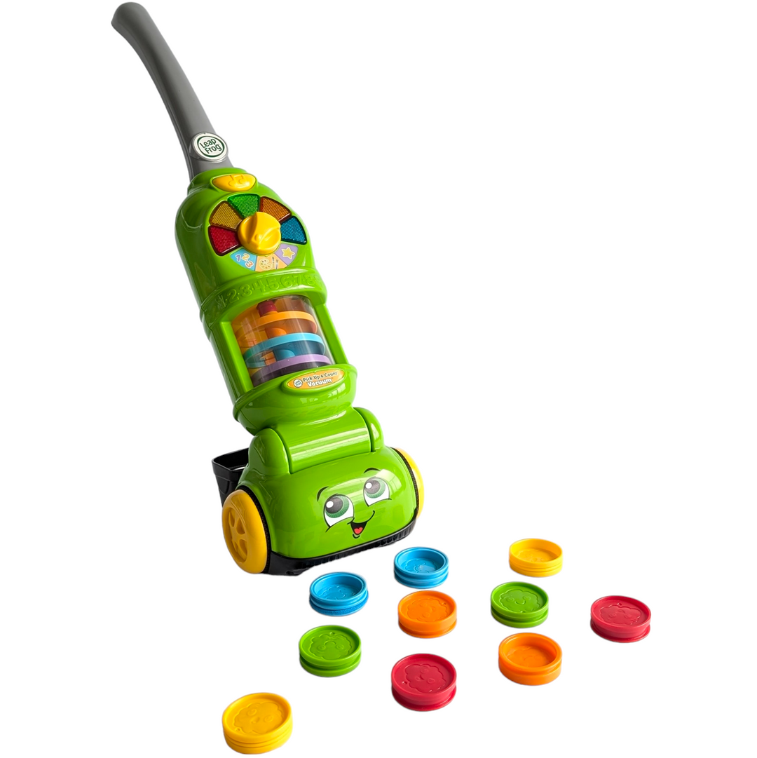 Leapfrog, Pick Up & Count Vacuum, Cognitive & Motor Skills Development, This smart toy picks up and counts ten play dust pieces as kids roll over them and recognizes each color. The tiltable handle adjusts to multiple heights, and includes easy-to-roll wheels for grow-with-me play. A handy bin on the back collects and stores all the dust pieces.