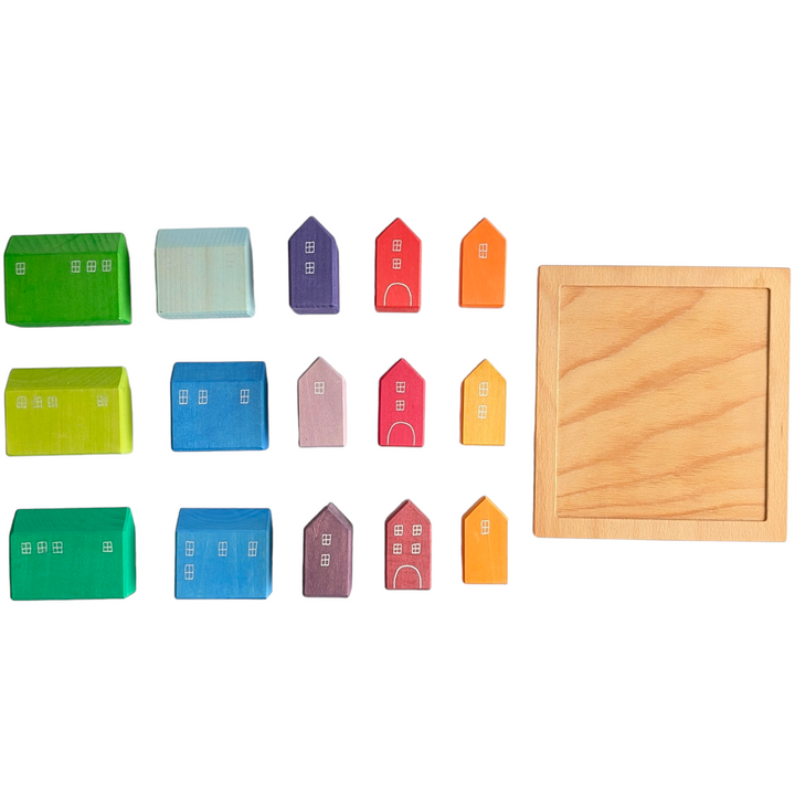 Grimms, Small Houses, Creative & Imaginative Play, Blocks in the shape of a house, with windows and doors painted by hand Flexible plaything Made by hand in Germany Included with a wooden tray for displaying and storing Solid wood construction with water-based, non-toxic staining