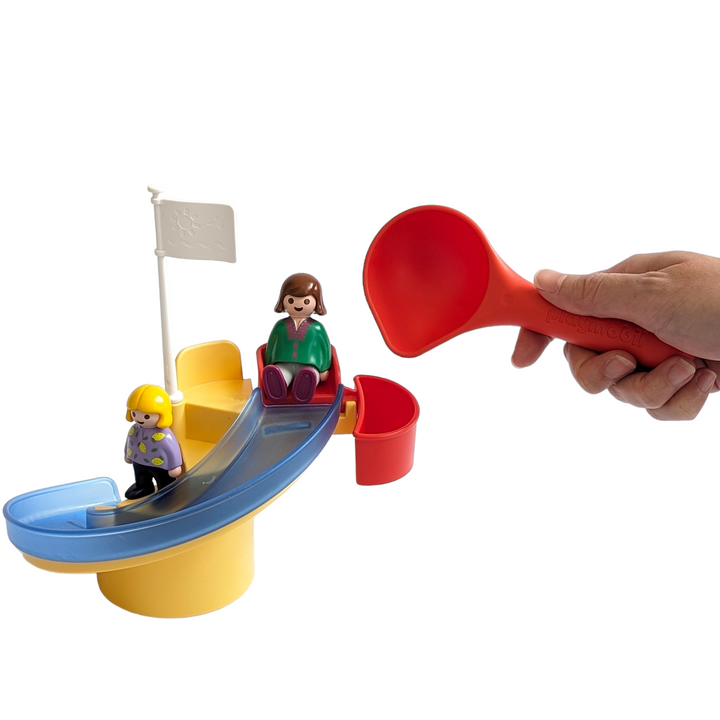 Play Mobil, 123 Water Slide Multicolour, Cognitive and Motor Skills Development, Slide fun with the water slide! Slide the figures by pouring water with the ladle into the container next to the seat. Can be combined with 70267 Happy Waterway & 70268 Waterwheel with Carousel. Dimensions slide with flag: 20 x 16 x 20 cm (LxDxH).
Summer, sun and water fun - simply belong together. With the PLAYMOBIL 1.2.3 AQUA Water Slide, even more fun is added to the splashing pleasure. First you go up on the slide, then yo