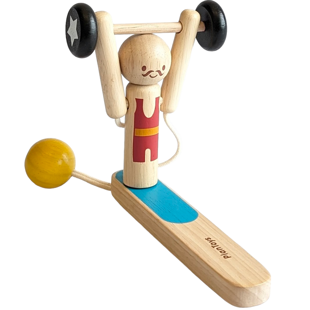 PlanToys, Weightlifting Acrobat, Cognitive & Motor Skills Development, Our Weightlifting Acrobat is a discovery of weight lifting achieved by gravitational pull. Children will enjoy swirling around the pendulum and watching the acrobat lift the weight up to the head. Perfect for the developmental learning of momentum and force as well as enhancing hand-eye coordination.