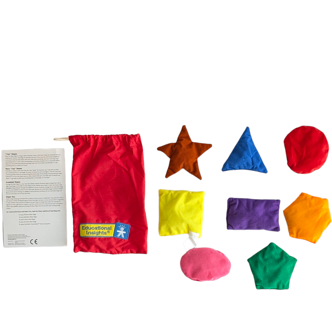 Educational Insights, Shapes Bean Bags, Sensory & Language Development , >With these vibrant beanbags, you can kinaesthetically reinforce shapes during games of throwing. Contains eight beanbags for active play that are embroidered with a shape phrase and come in various colours and shapes. provides ideas for interactive shape games in the Activity Guide. stores every component in a drawstring pouch. Little ones may easily manage the 4-5 inch diameter, lightweight washable felt bean bags.