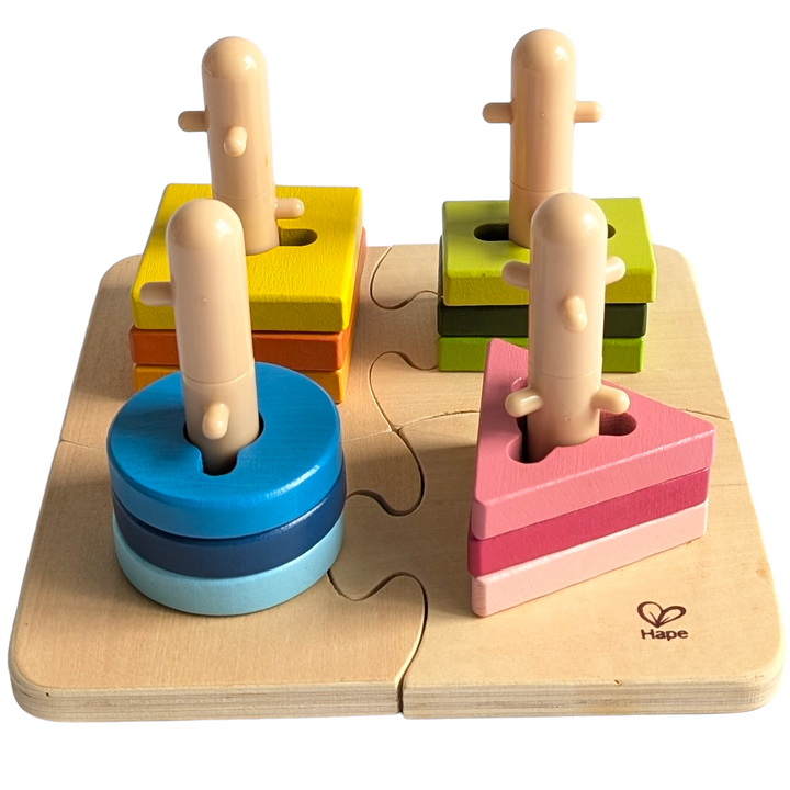 Hape, Creative Peg Puzzles, Cognitive & Motor Skills Development, Practice basic shape and color recognition with this best-selling, innovatively designed toy from Hape! The Creative Peg Puzzle has grooved shapes and pegged posts, adding an extra dimension of challenge to this colorful puzzle, and providing children hours of entertainment. Join the four puzzle bases together and then twist the variously shaped and colored puzzle pieces onto the posts. 