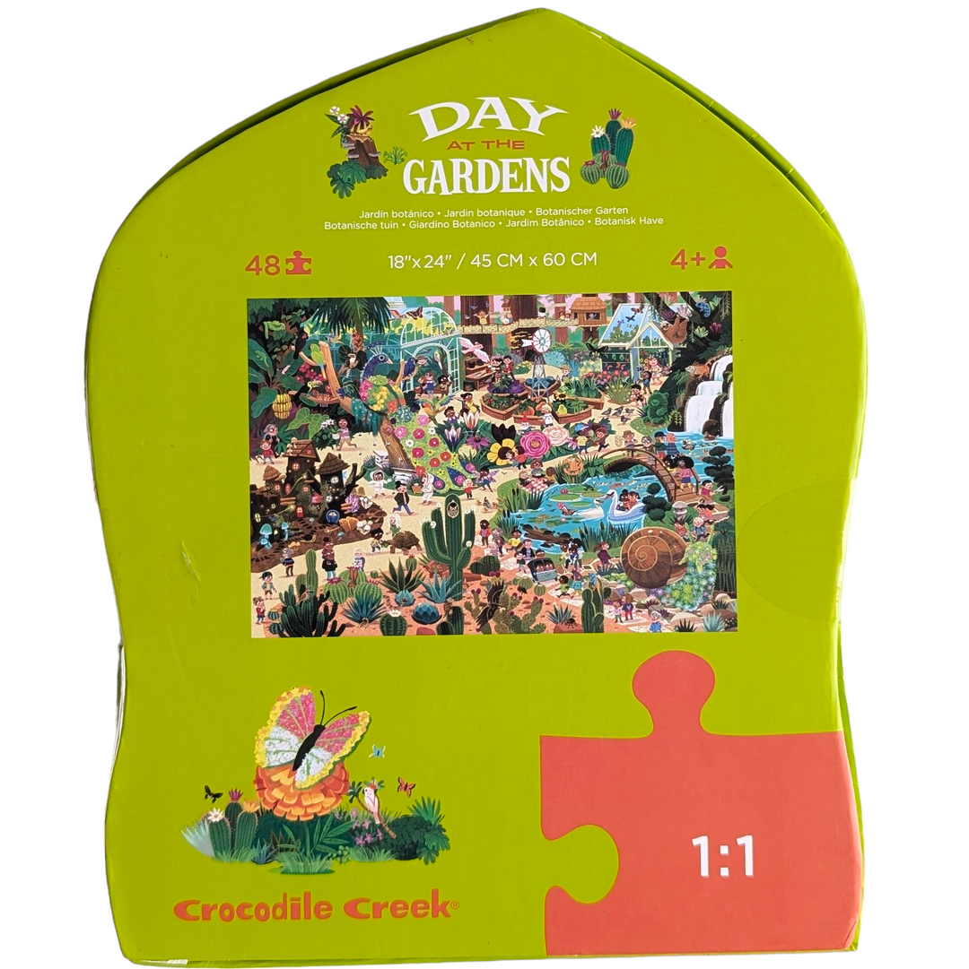 Crocodile Creek, Day At The Gardens - 48 Piece, Cognitive & Motor Skills Development, The Crocodile Creek Day at the Botanical Garden 48-piece puzzle is great both for learning and play and will transport the children in your life to a vibrant, whimsical botanical garden with a wonderful array of surprising, beautiful and interesting discoveries from the world. Packaged in a uniquely museum shaped box, it is guaranteed to delight both kids and parents.