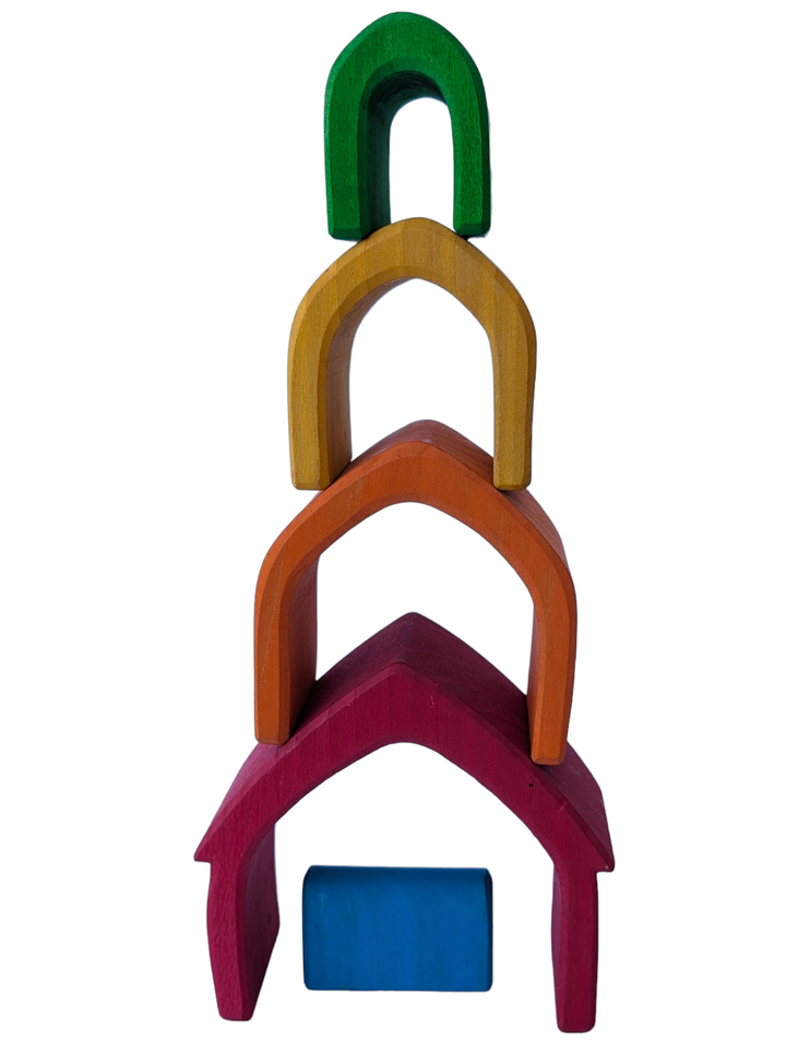 Grimms, Rainbow House, Creative & Imaginative Play, This gorgeous wooden house set will become a firm favourite in your playroom. It comprises 5 little houses, each a different shade of the rainbow, carved from a single piece of lime wood and naturally stained using non-toxic, water-based colour.  This natural finish allows the grain of the wood to shine through and ensures that these house blocks are safe for young children.

Split them up and make fairy doors, tunnels for cars and pens for farm animals;