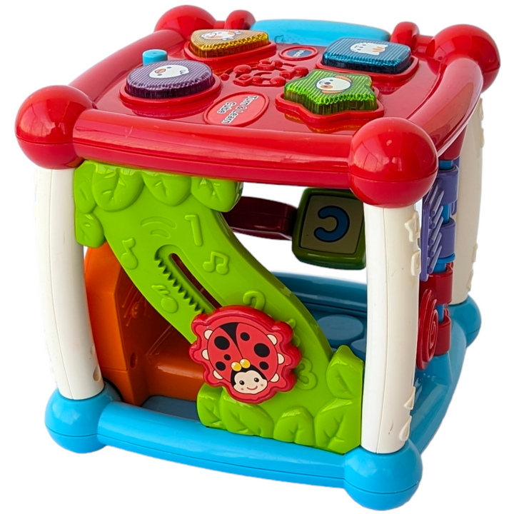 VTech, Turn and Learn Cube, Sensory & Language Development, Exploration and fun is around every corner with the Busy Learner’s Activity Cube™ by VTech®. Featuring five sides to explore, this play cube attracts your baby’s attention and encourages imaginative play with music, light-up buttons, colors and more. Shape and animal buttons introduce animal names, animal sounds and shapes. Press and slide musical instrument buttons introduce instrument names, sounds and colors.