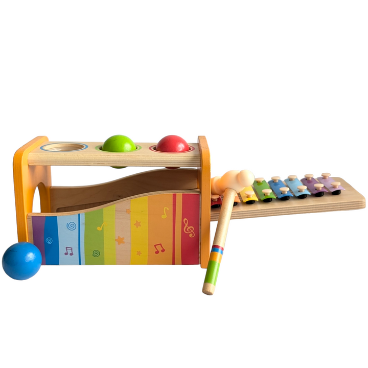 Hape, Pound & Tap Bench with Xylephone, Cognitive & Motor Skills Development, Hape's Pound and Tap Bench with Slide Out Xylophone is a multifunctional musical delight and sound experience for toddlers.

Toddlers ages 12 months to 3 years can explore different notes and sounds by letting the balls fall on the keys or slide out the xylophone to create their own unique sound with a wooden mallet.

 